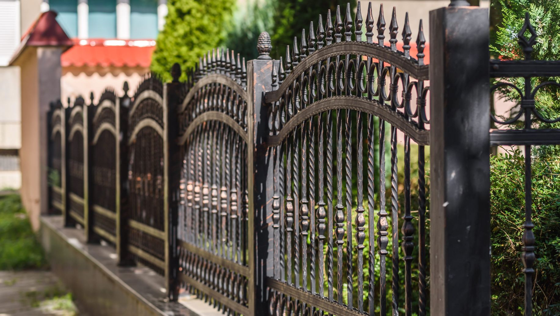 How Can You Add Privacy To Wrought Iron Fences? - GS Fence Company