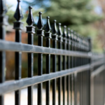 focused picture of a black iron fence