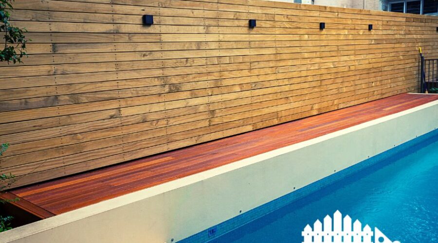 Wooden privacy fence installed by G's Fence Company in San Antonio, TX, surrounding a modern pool area